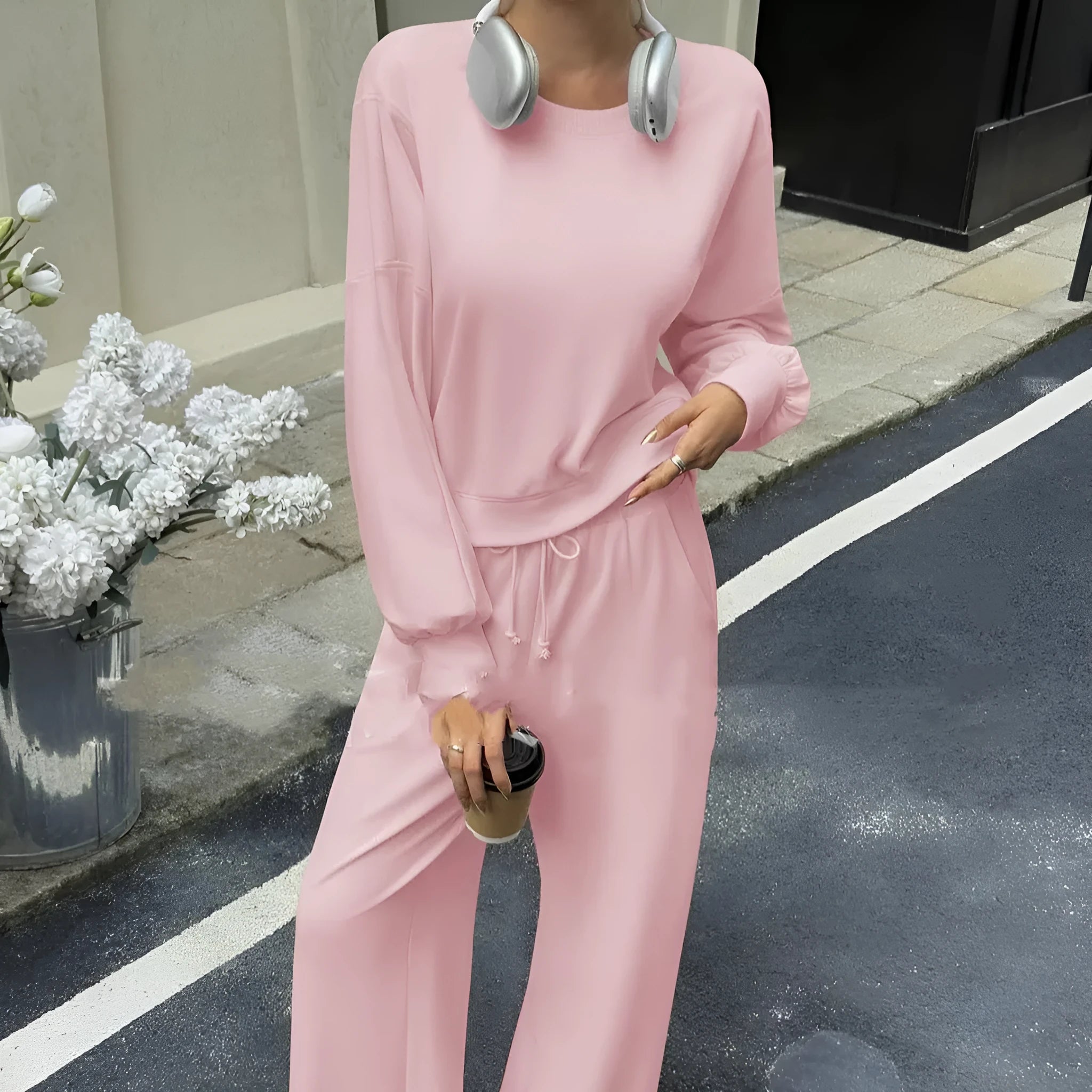 Women's solid colour polyester two-piece casual set with long sleeves and trousers.