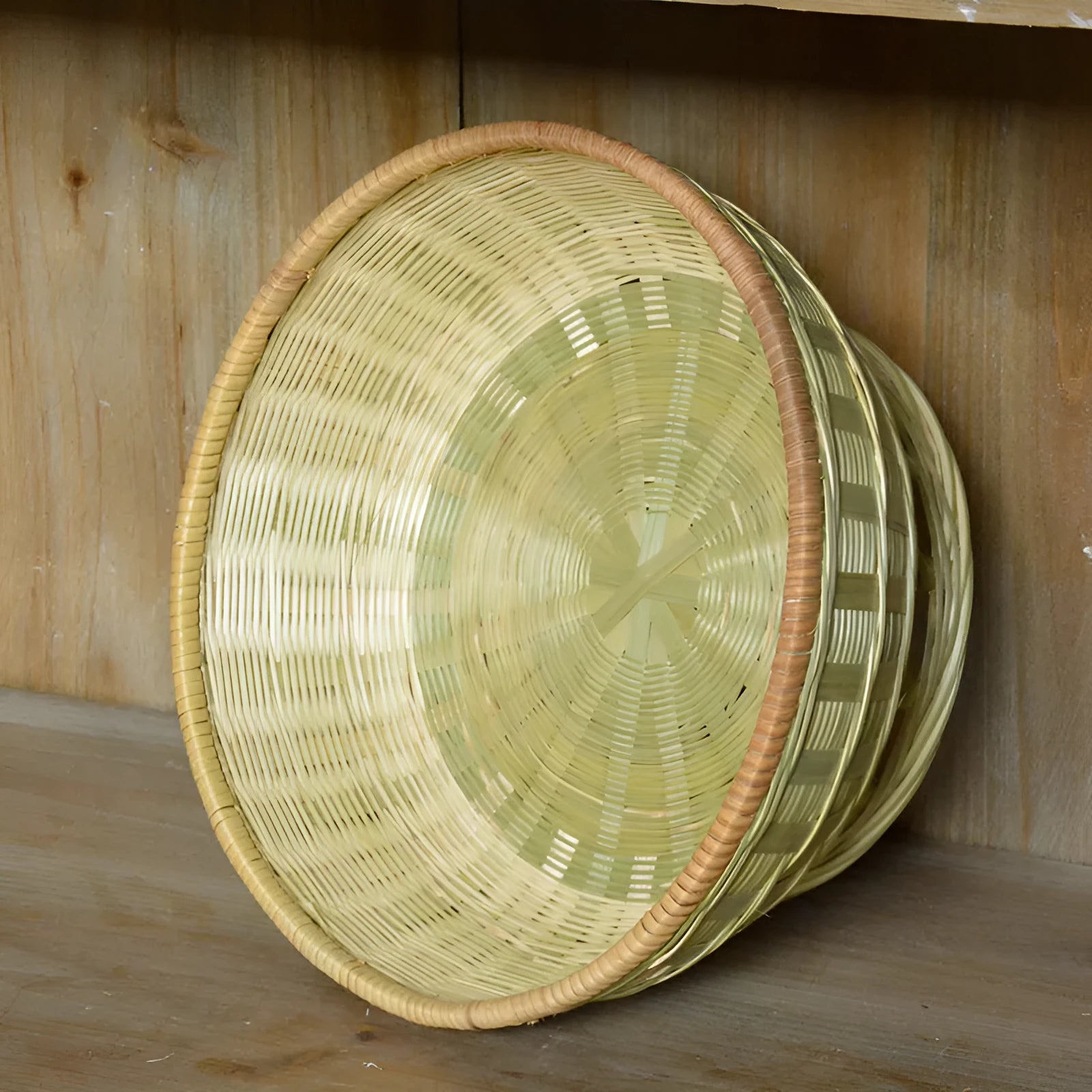 Handmade natural bamboo storage basket in a rectangular woven shape.