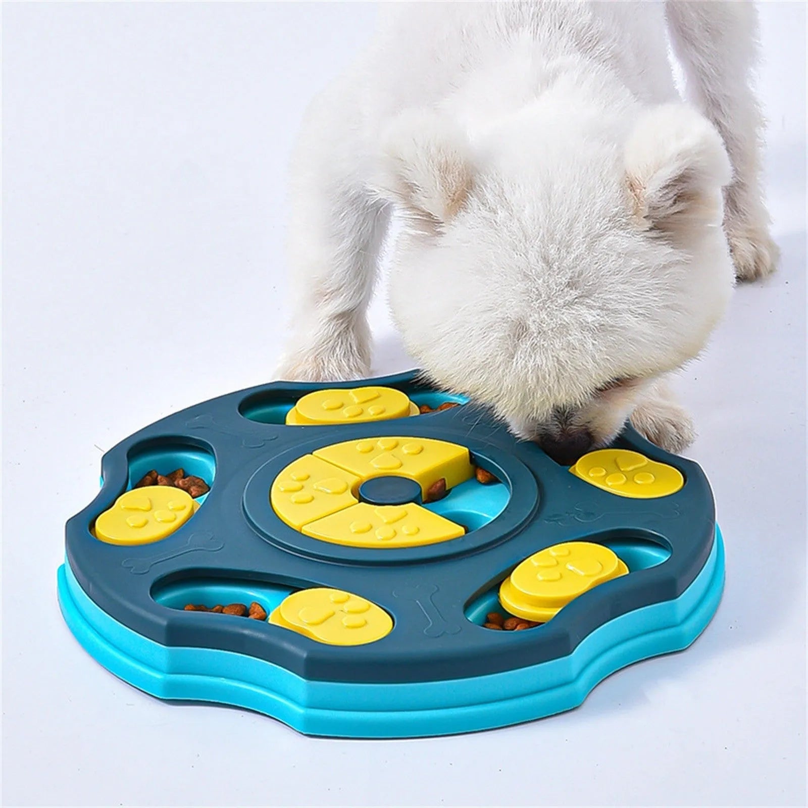 Blue and pink dog puzzle feeder toy with multiple compartments for interactive food searching gameplay