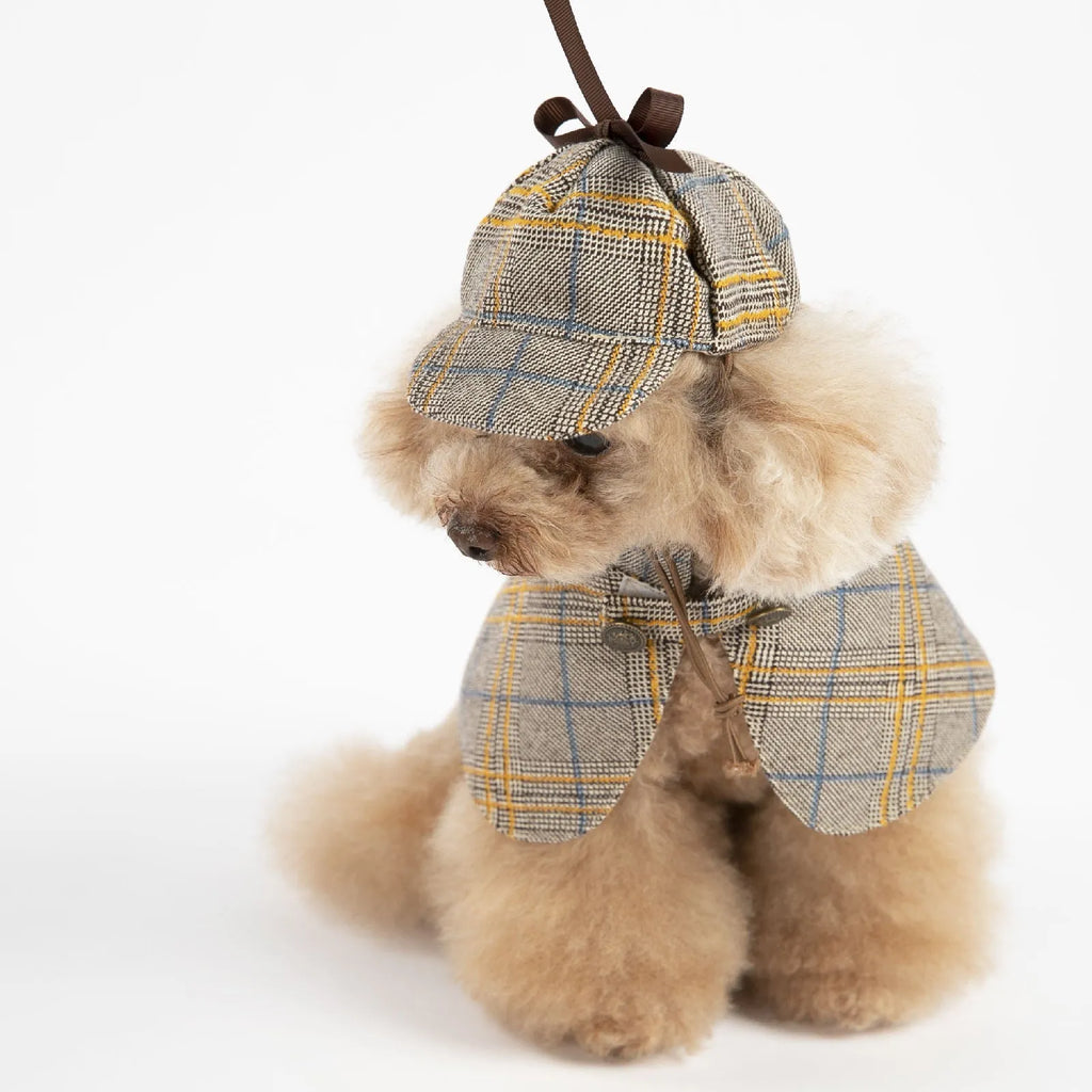 Camel-coloured cotton detective suit cloak for a small dog on a neutral background.