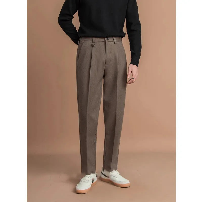 Men's straight leg polyester trousers in black on a hanger, business casual style