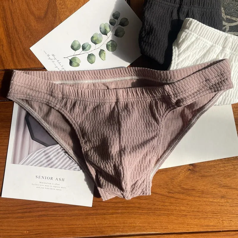 Men's cotton briefs in solid colours showing mid waist and triangle design