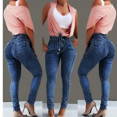 Women's fringed jeans in cowboy denim fabric showing decorative leg fringing detail