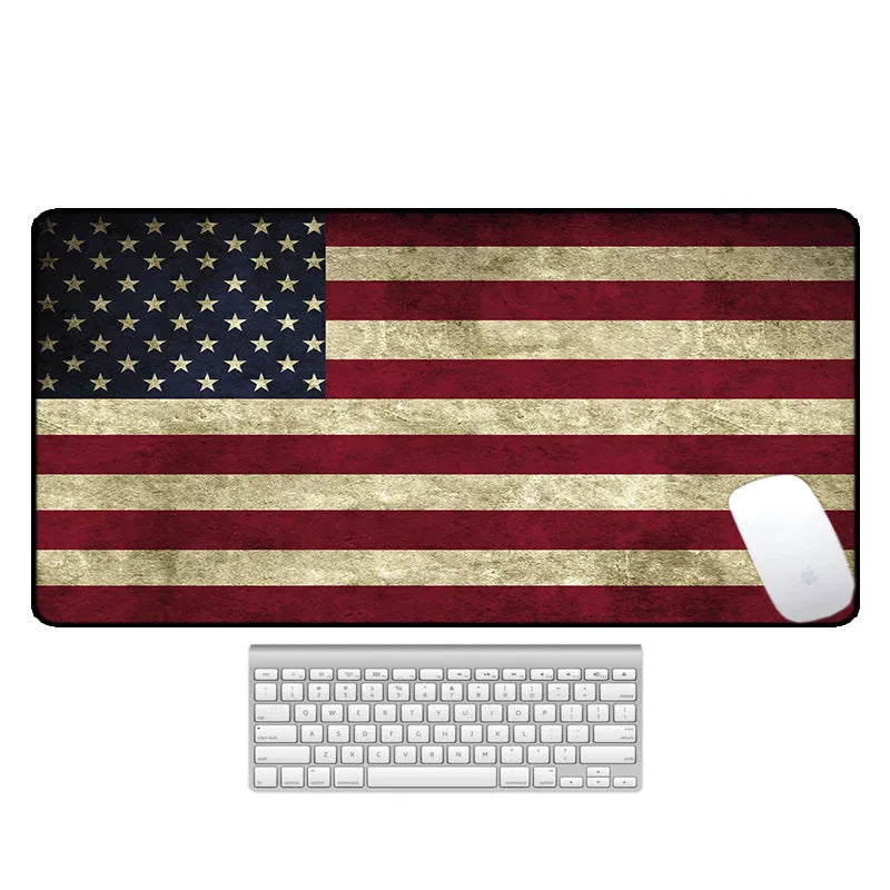 Large thermal transfer printed mouse pad with natural rubber non-slip base on a desk.