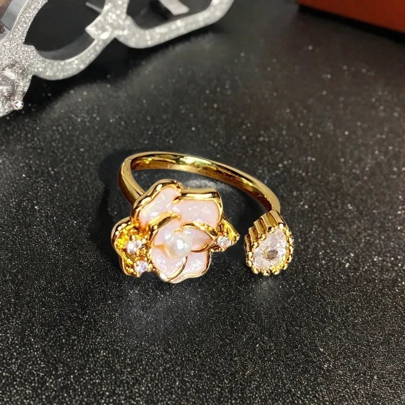 Adjustable copper vintage gourd ring with inlaid zircon stones showing floral and bow design elements