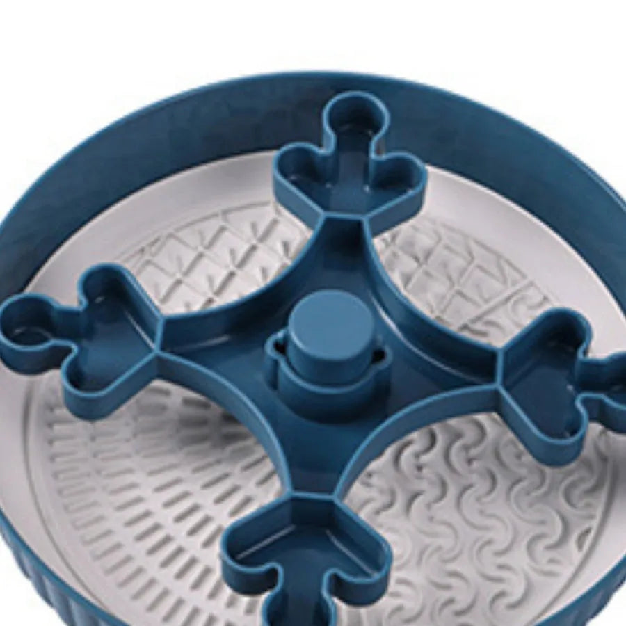 Grey plastic pet bowl with rotating windmill-pattern slow feeder licking mat inside
