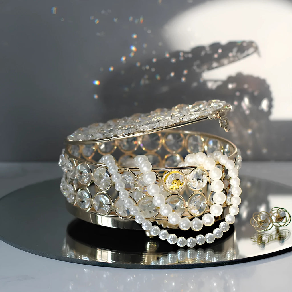 Crystal glass jewellery box with transparent sides and a French gold metal frame.