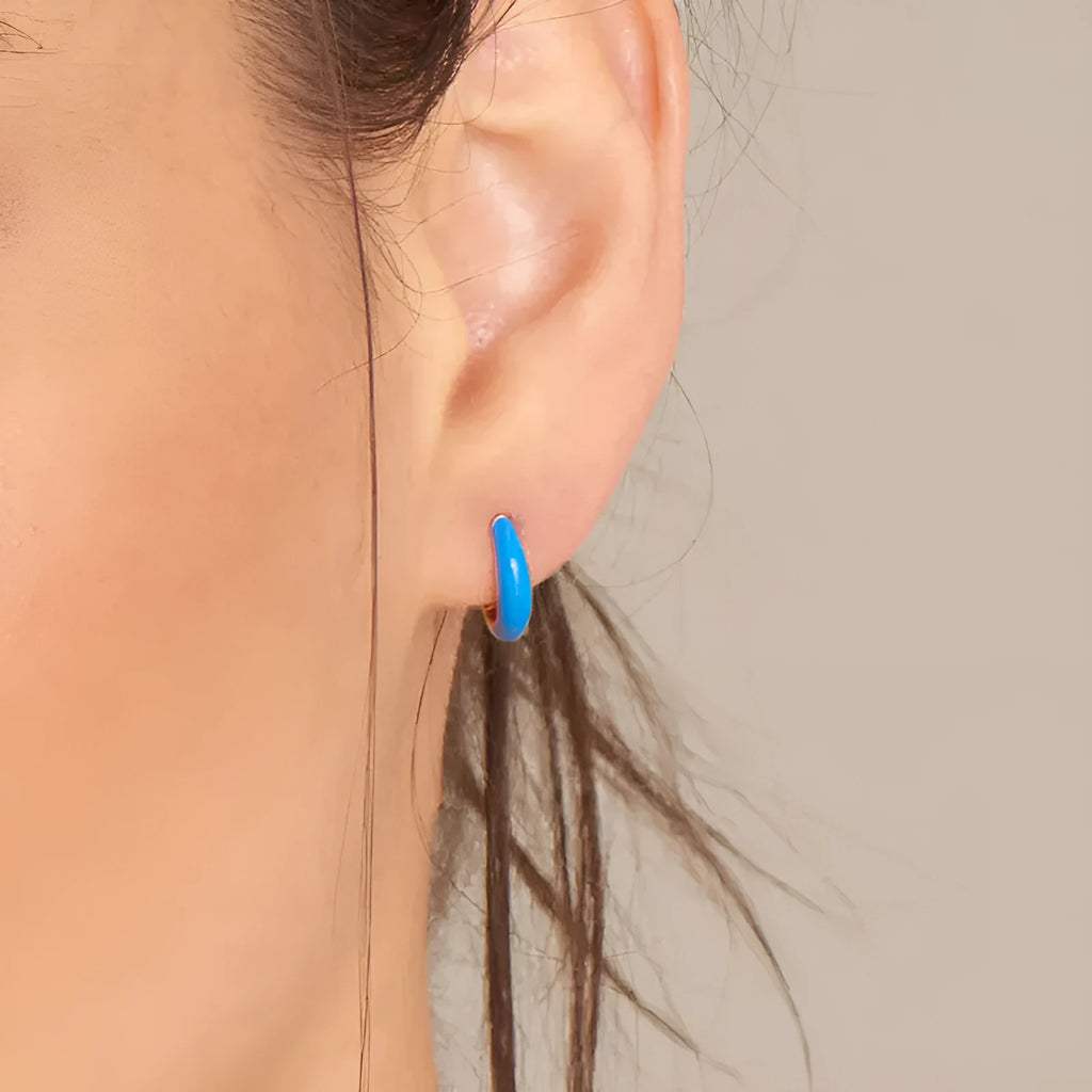 Geometric U-shaped epoxy earrings with a dripping oil finish in various colours.