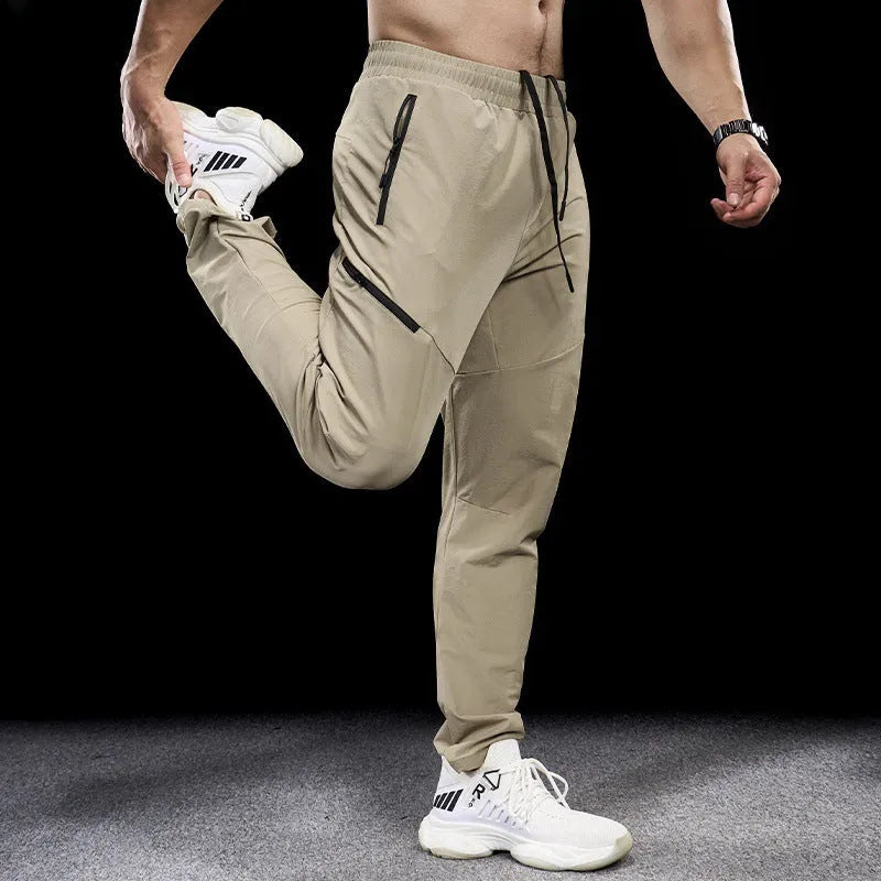 Men's black waterproof quick-drying nylon workout trousers for sports and exercise