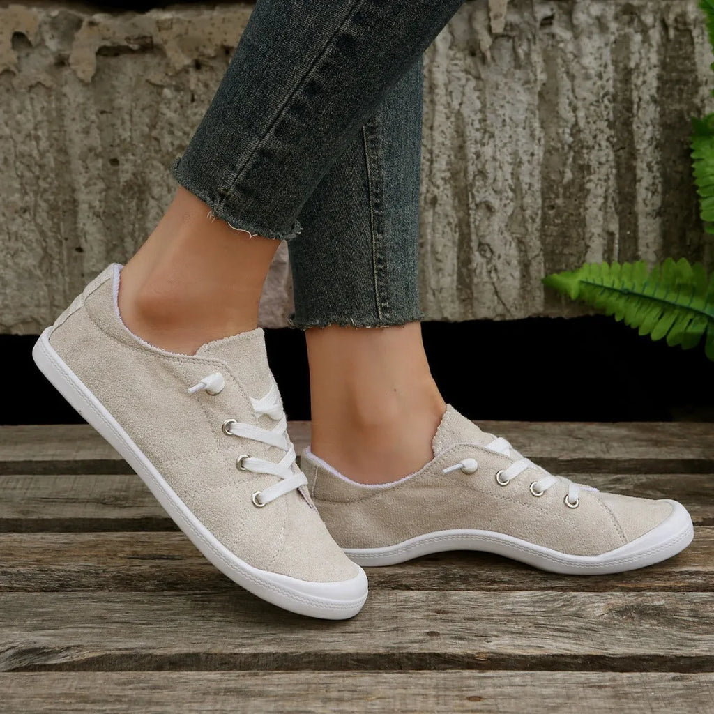 Women's creamy-white casual sneakers with fabric upper and rubber sole