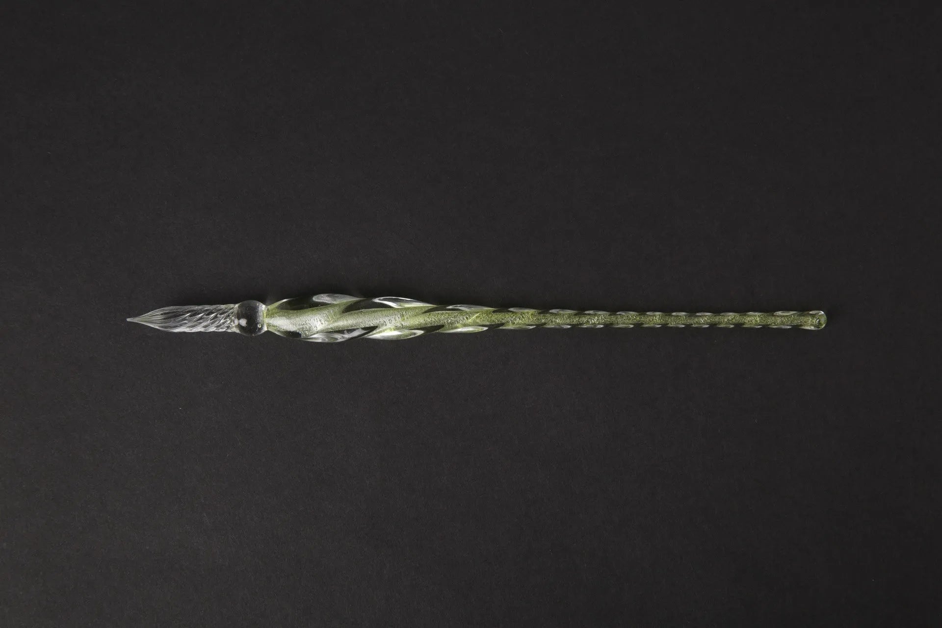 Transparent glass art pen with coloured ink dipped design in a gift box.