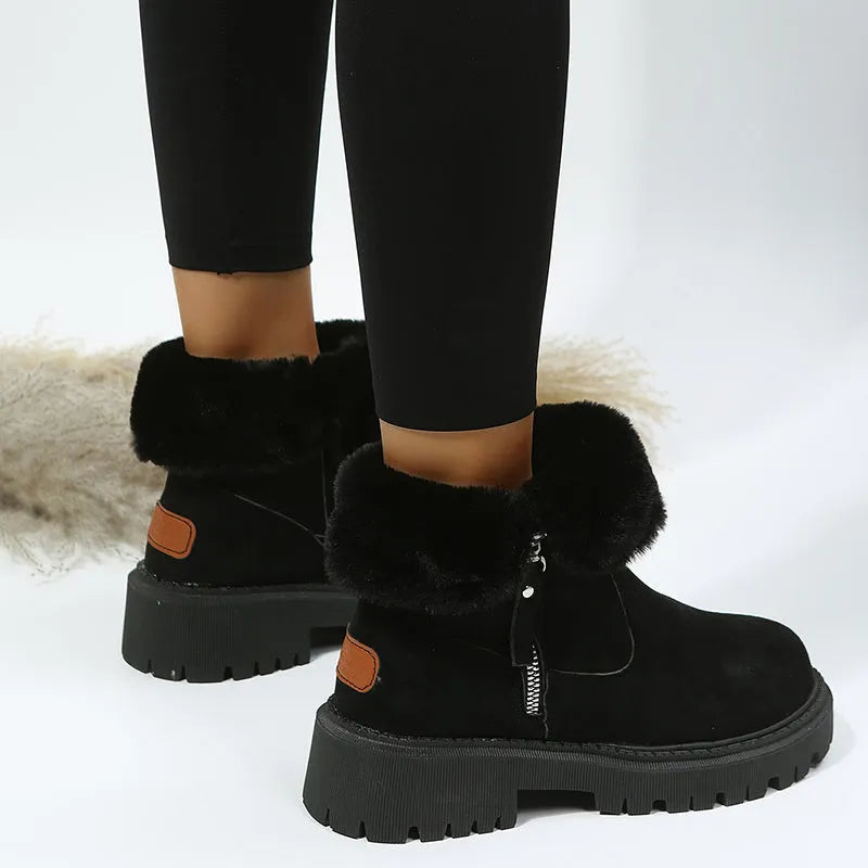 Women's black high-top snow boots with side zipper and thick plush lining on a winter background.
