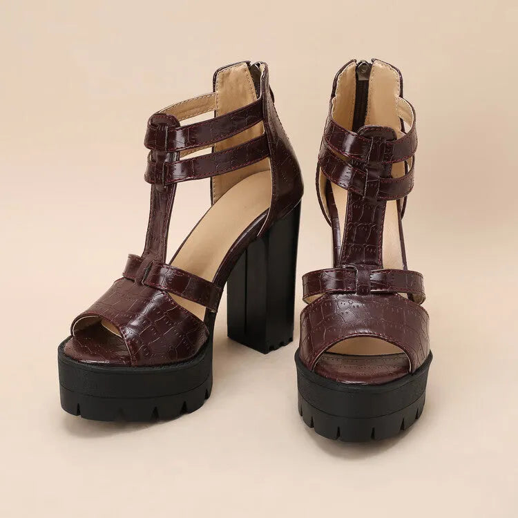 Women's black platform high heel sandals with ankle strap and back zipper on a round toe.