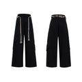 Men's dark blue straight-leg cotton jeans with 3D cutting, belt stitching, and decorative pocket tassels.