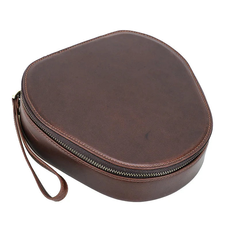 Brown genuine leather storage bag for Apple AirPods Max with lanyard on white background