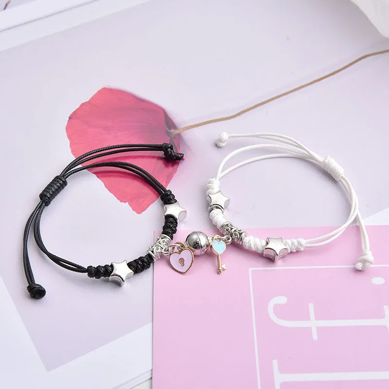 Magnetic couple bracelet pair with alloy electroplating in various designs including clover and crown patterns