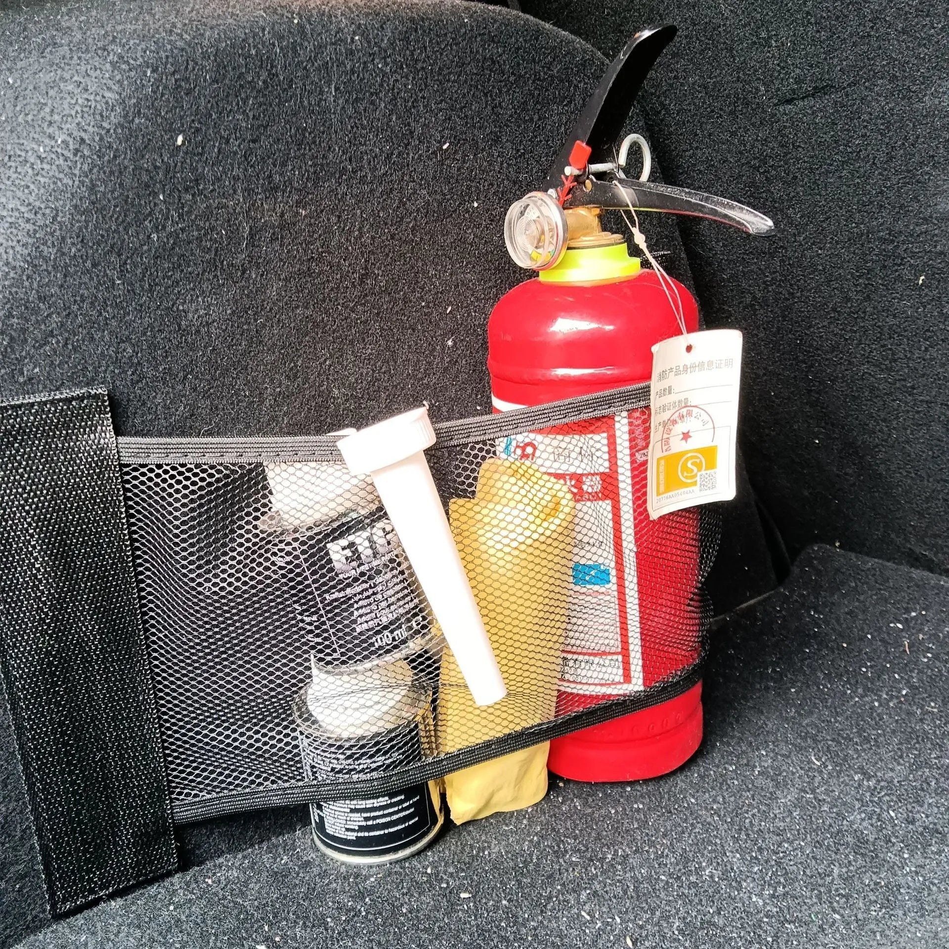 Black elastic polyester storage net for securing items in a car boot, shown in 20x35cm and 20x45cm sizes.