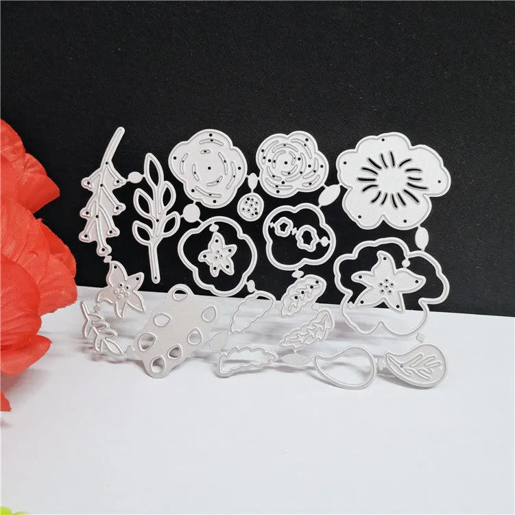 Silver carbon steel flower paper cutting knife mould measuring 14.3 by 9.9 cm