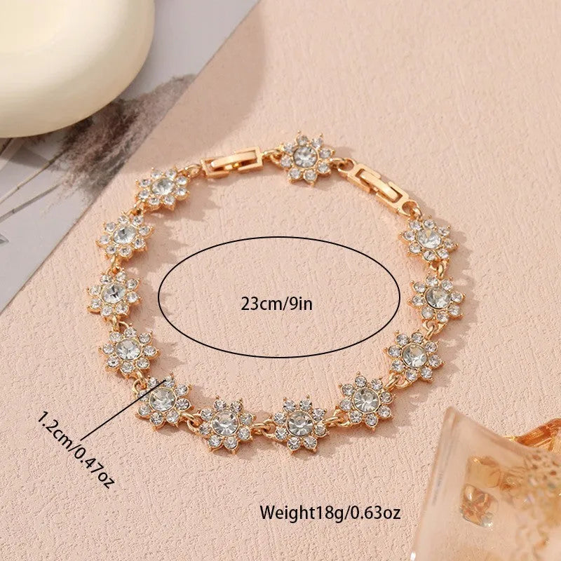 Zinc alloy flower bracelet with electroplated colour finish and colourful crystal decorations in gold and silver variations