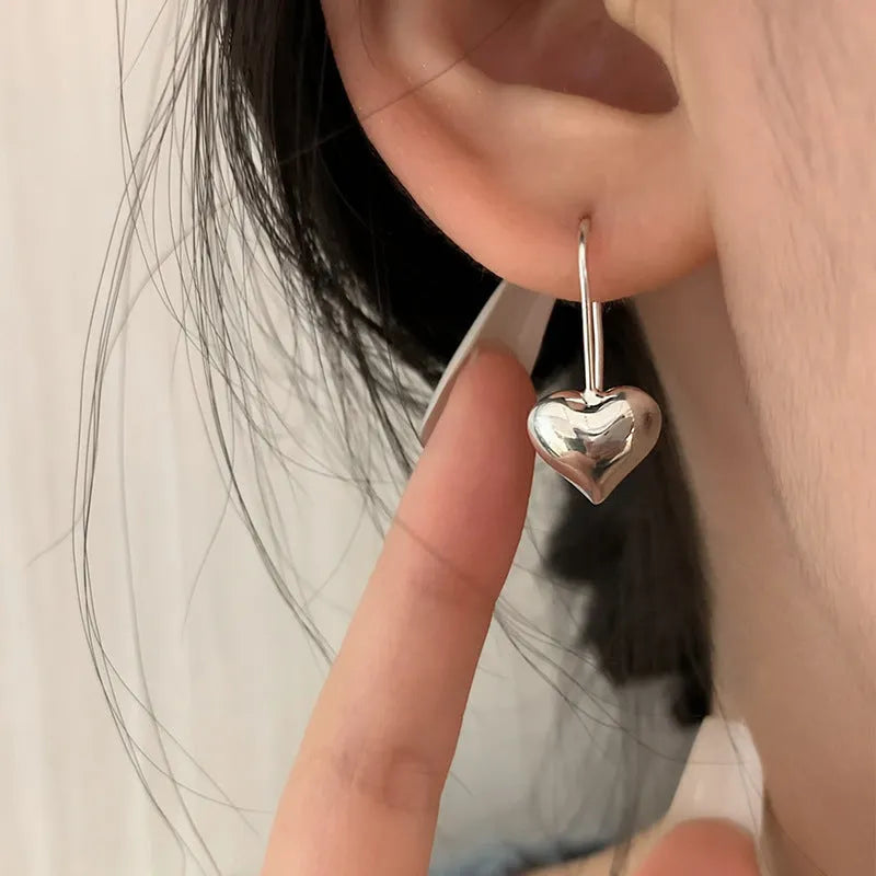 Silver heart earrings with glossy three-dimensional design and Korean style ear hooks