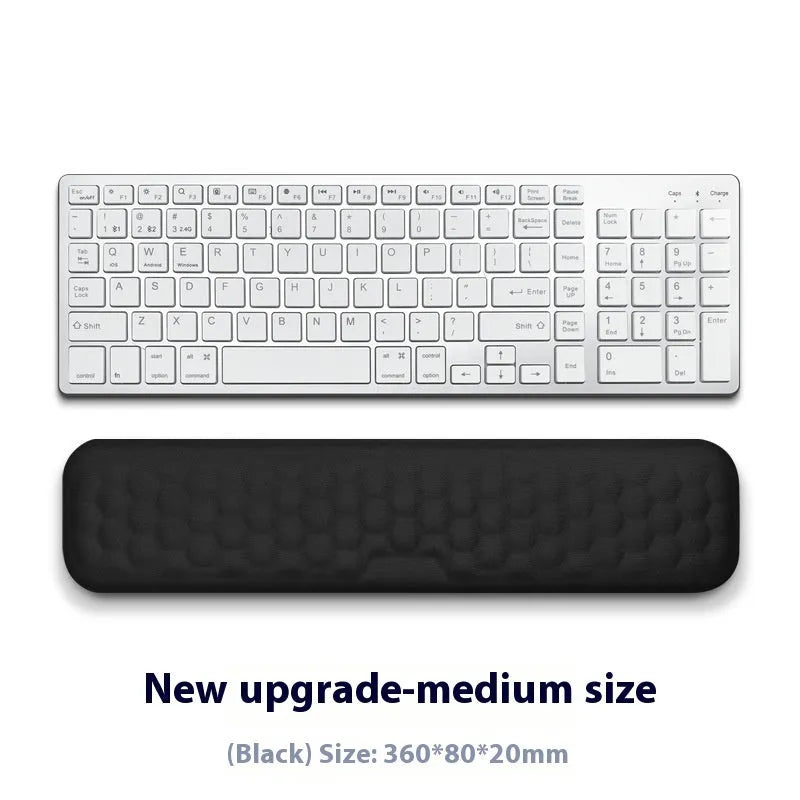 Memory foam mouse wrist rest pad with silicone base in black cloth cover option on desk