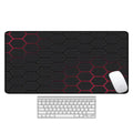 Large thermal transfer printed mouse pad with natural rubber non-slip base on a desk.