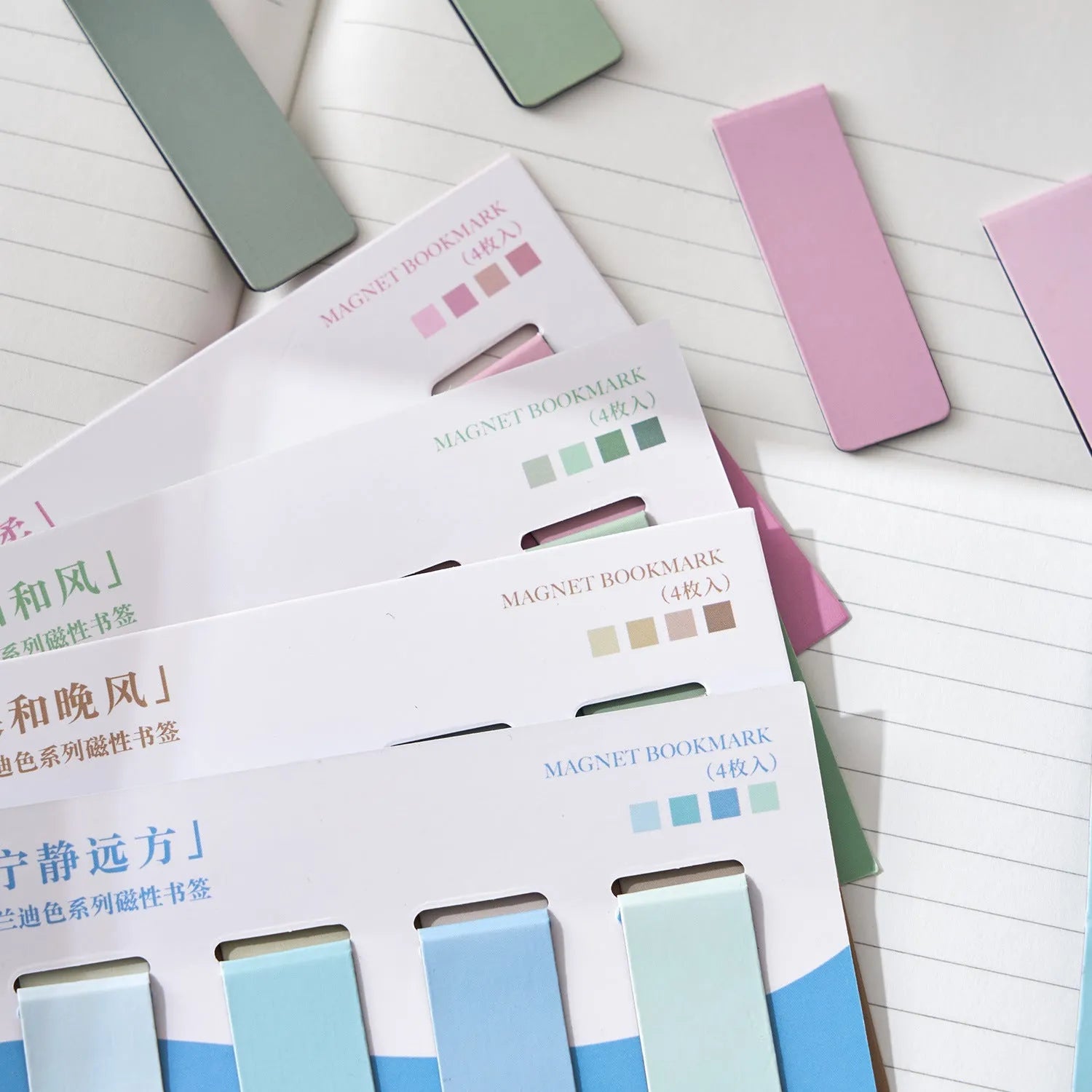 Set of four Morandi Series pastel colour-block magnetic bookmarks on a book page.