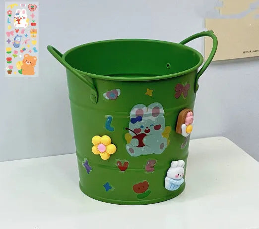 Round metal desktop pen holder in a choice of colours, some with decorative sticker patches.