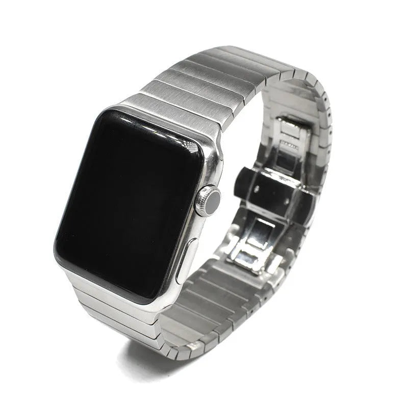 Silver stainless steel metal Apple Watch band with butterfly clasp on a 40mm watch case.