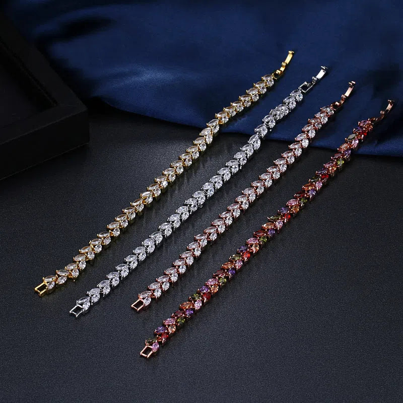 Women's round shape horse eye zircon bracelet in gold finish with inlaid gemstone on copper base