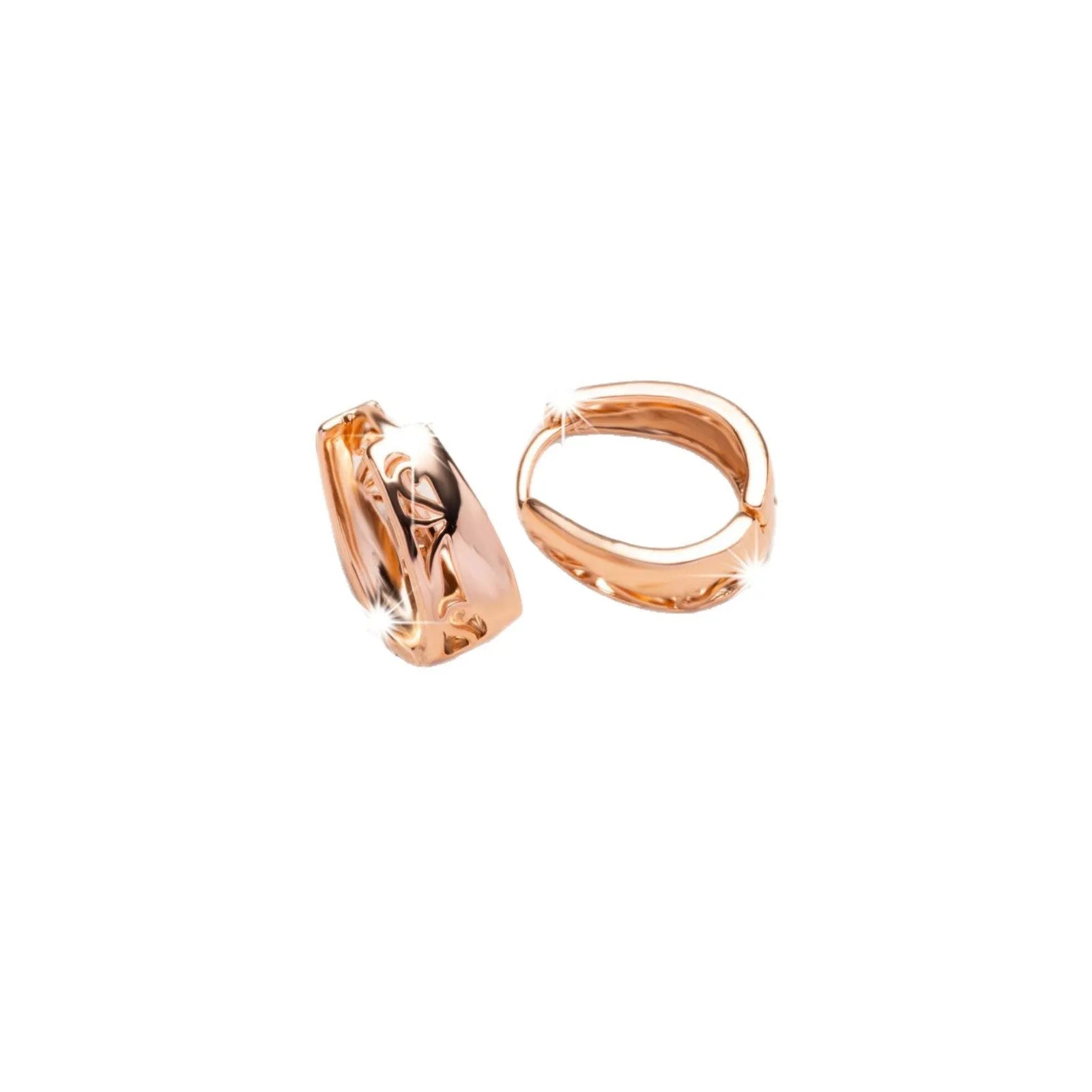 Rose gold hollow carved U-shaped copper earrings on light background
