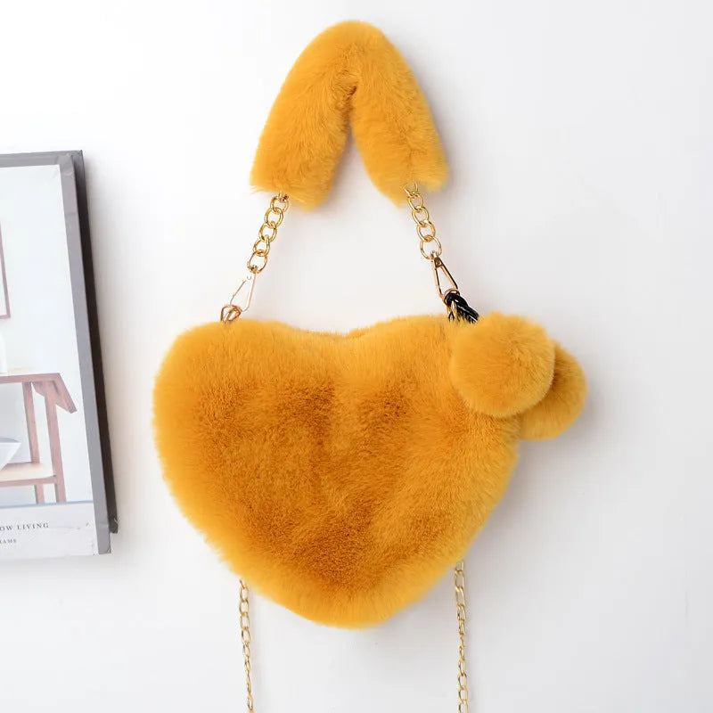 Heart-shaped women's plush handbag with soft texture and detachable shoulder strap in medium size
