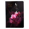 A5 notebook with luminous purple cover open to show pages filled with colour illustrations.