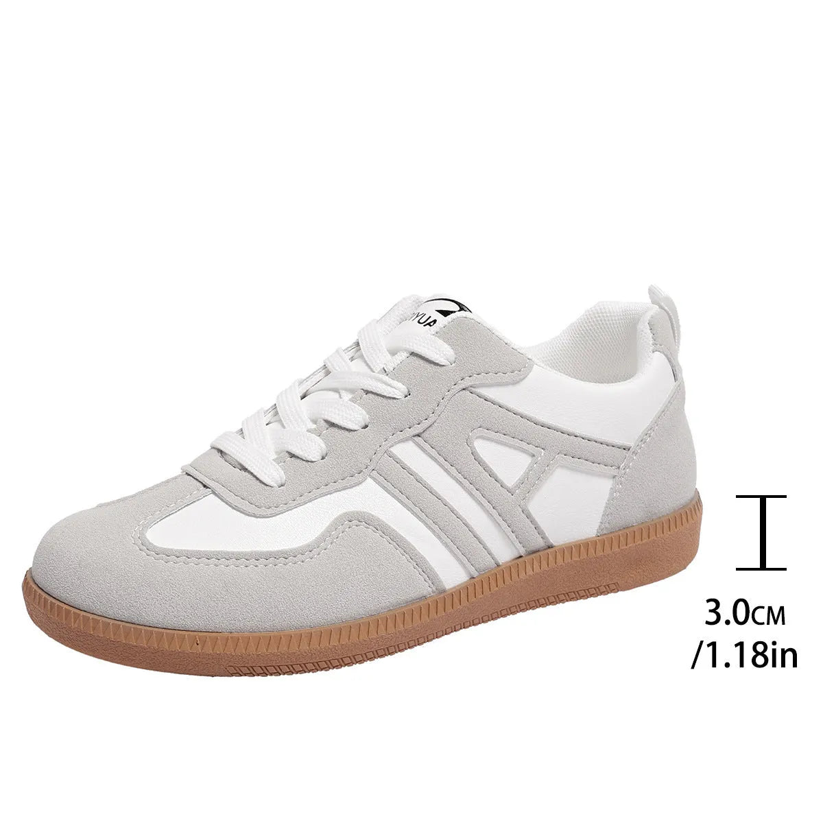 Women's retro grey jogging shoes with lace-up front and cross-strap detail on a rubber platform sole.