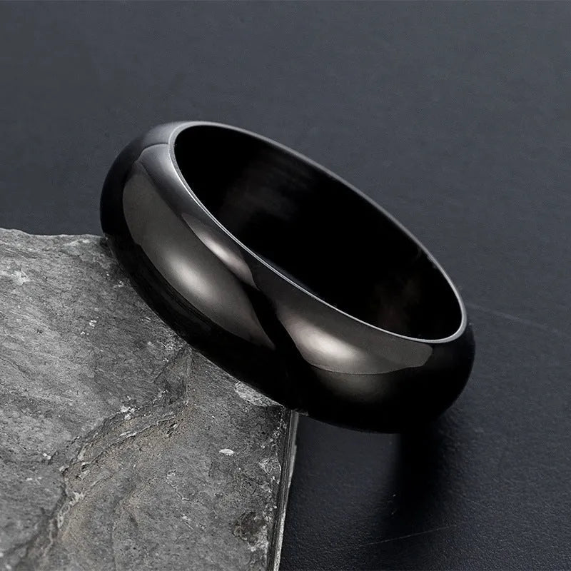 Glossy electroplated titanium steel ring in gold, black, and steel colours showing band detail