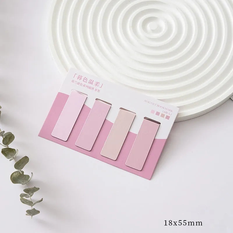 Set of four Morandi Series pastel colour-block magnetic bookmarks on a book page.