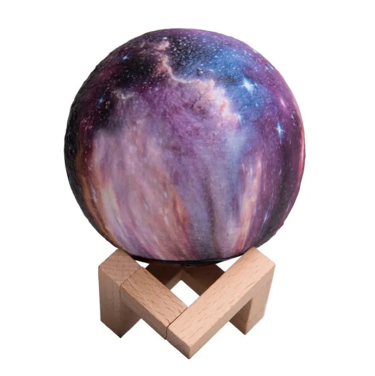 3D-printed spherical lunar night light with remote control on wooden table