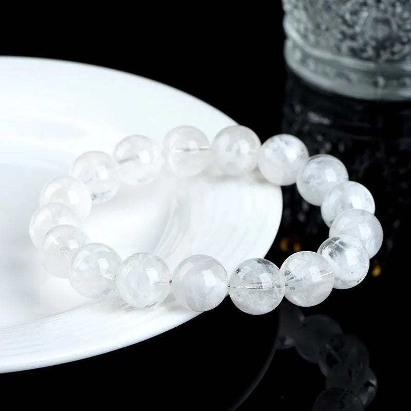 Women's natural blizzard snowflake round crystal bead bracelet with Ruyi and Xiangyun design.