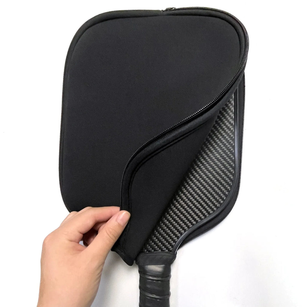 Black neoprene protective sleeve for table tennis racket on solid background