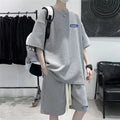 A waffle-textured leisure sports suit consisting of a short-sleeve top and shorts, shown in blue.