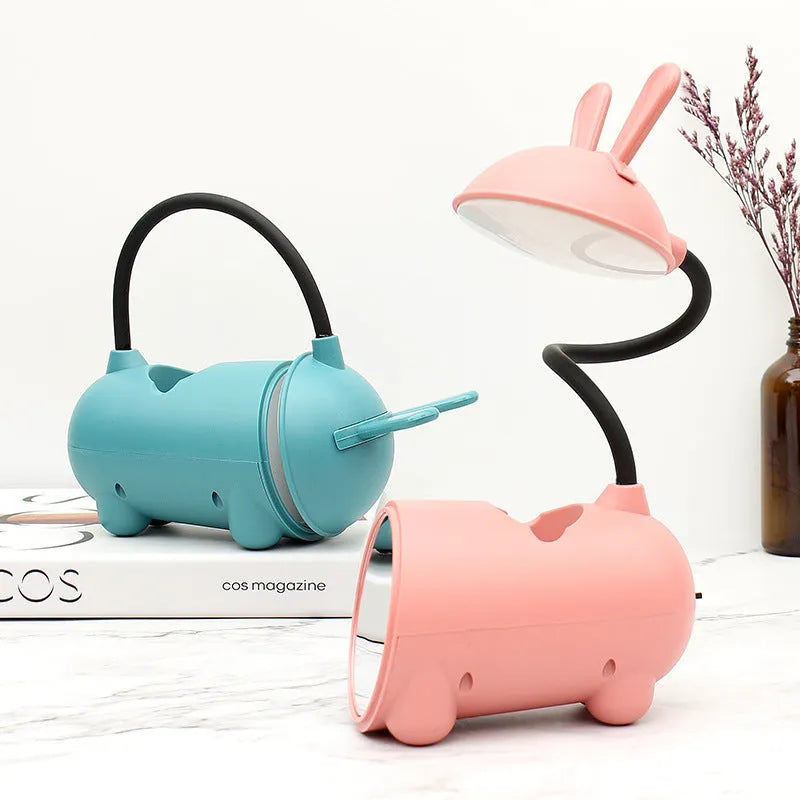Cartoon-style USB table lamp with pen storage compartment in green colour