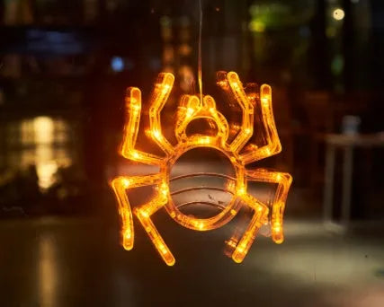 Seven Halloween-themed LED hanging lights with suction cups including spiders, pumpkins and ghosts