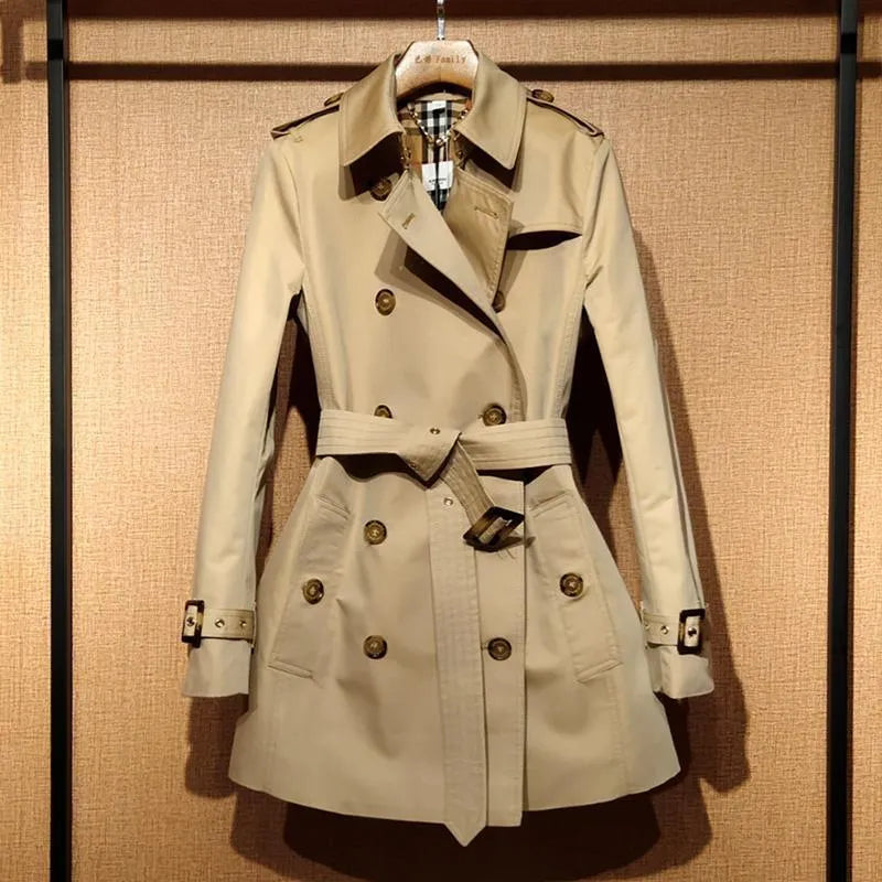 Khaki double-breasted trench coat for women with flight sleeves, shown on a hanger.