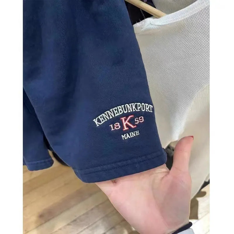 Women's dark blue cotton hot pants shorts with white flag embroidery detail