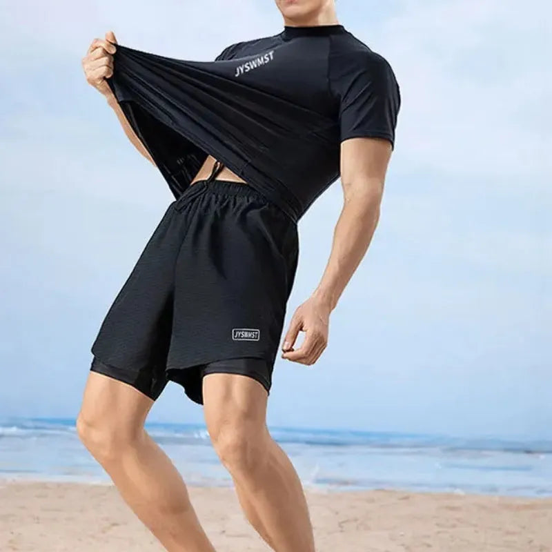 Men's two-piece polyester swim set showing short-sleeved swim top and matching trunks on a hanger.