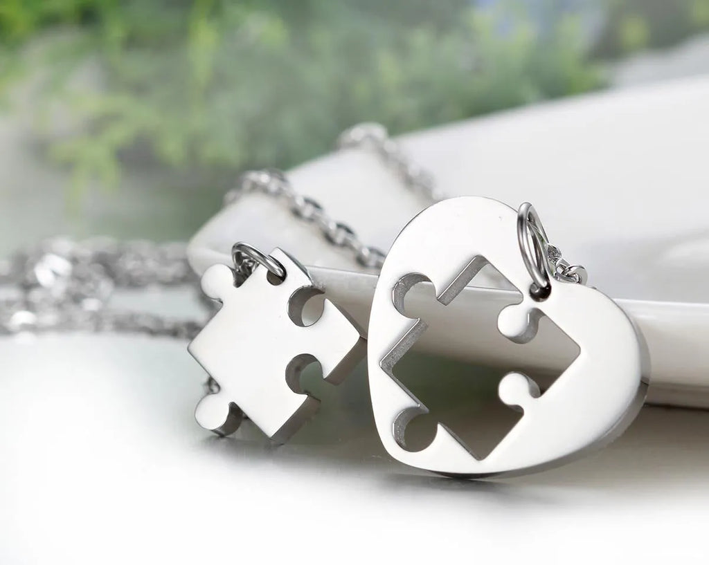 Glossy stainless steel love puzzle couple pendant in silver finish, heart shape 52mm long