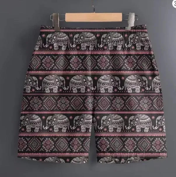 Men's casual polyester shorts in camouflage print, laid flat to show size and pattern.