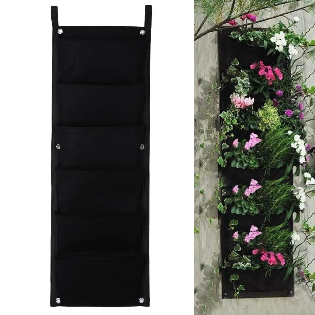Vertical felt wall garden planter with 18 planting pockets hanging on outdoor wall