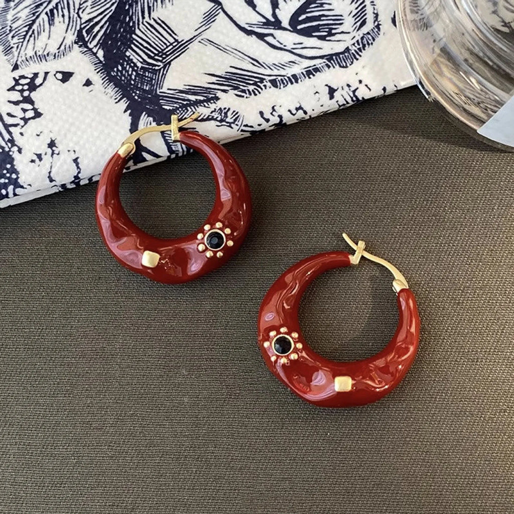 Hong Kong style retro ear studs with dripping oil finish and rhinestone detail in black and red colours