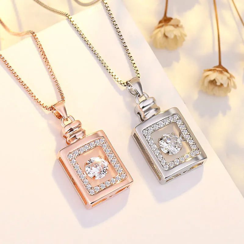 Heart-shaped pendant necklace with crown and bow design in rose gold or silver finish